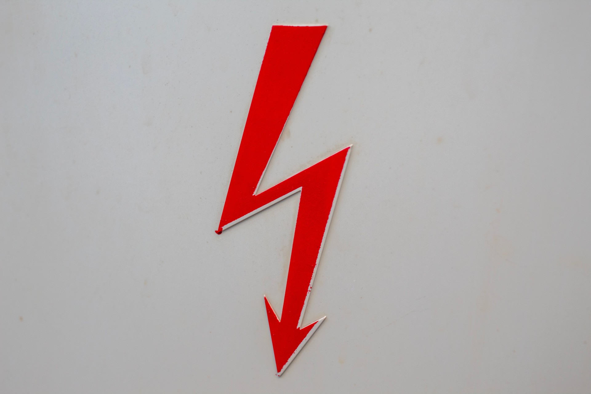 Bold red lightning bolt and arrow